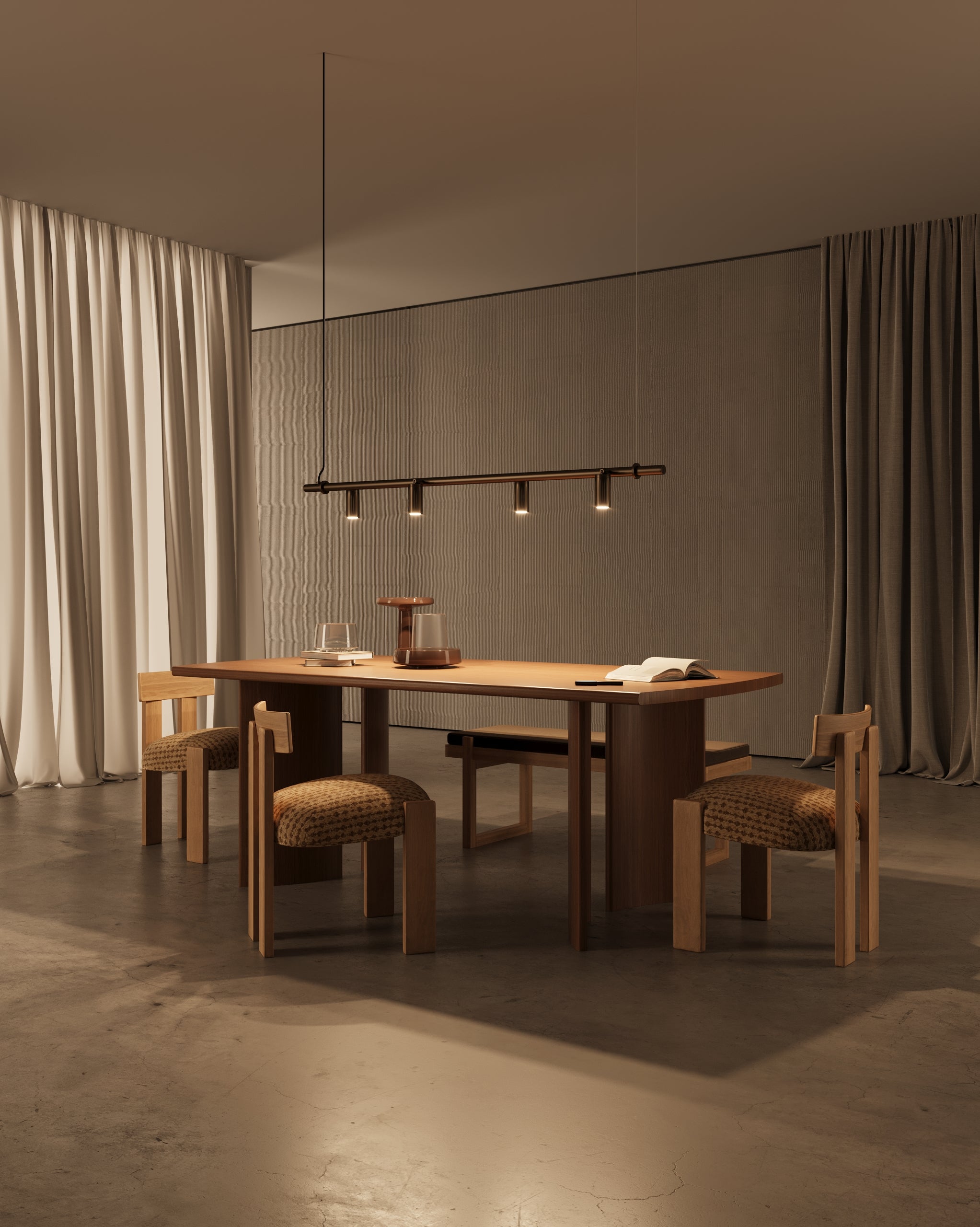 Browned brass spots hanging over dining table