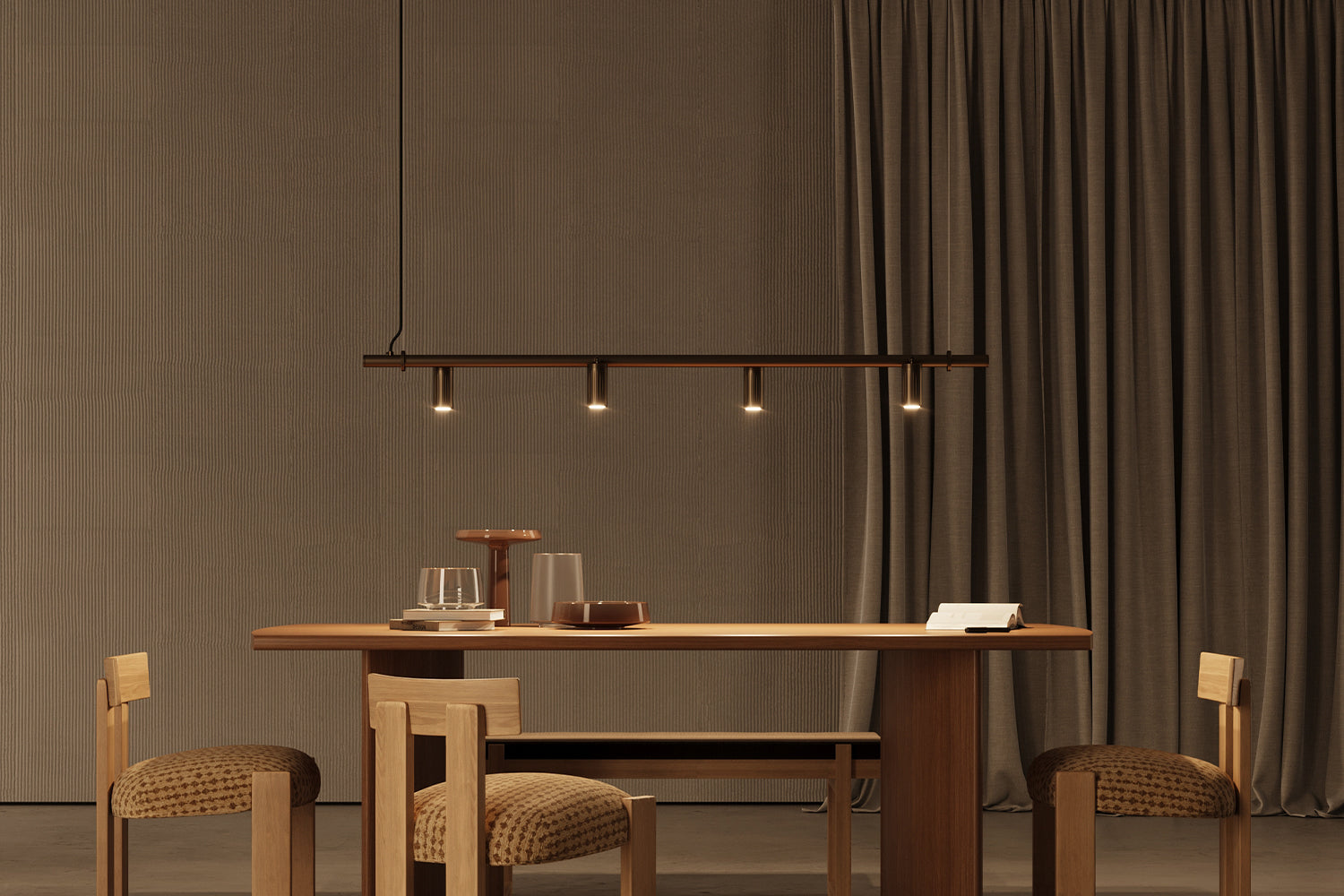 browned brass pendant spot light over a dining table