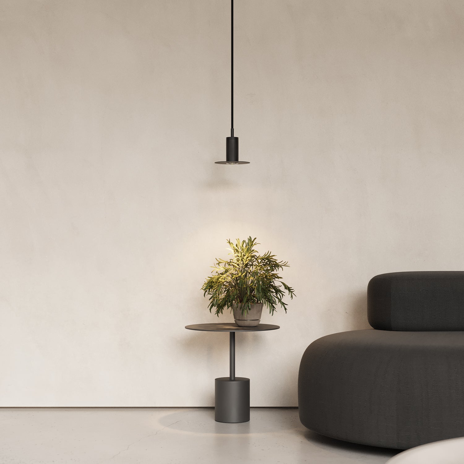 black pendant lamp beside a sofa