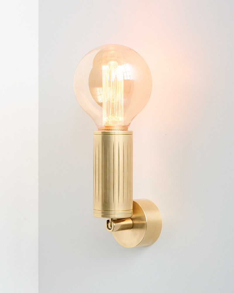 brass wall lamp with bulb