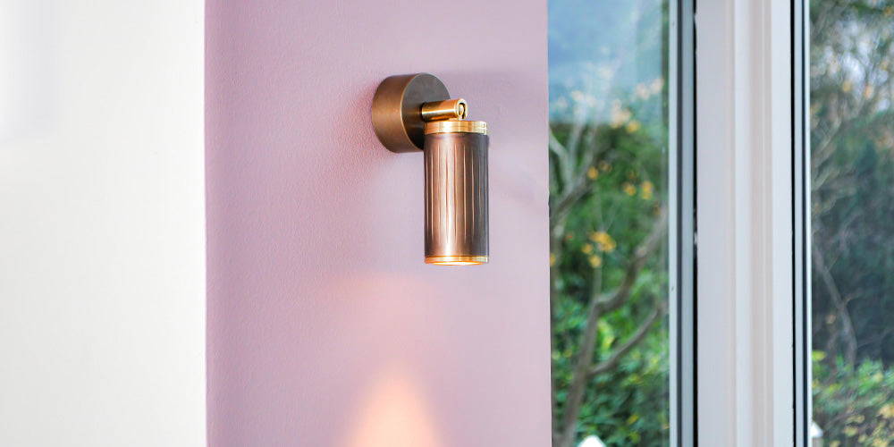 browned brass wall spotlight