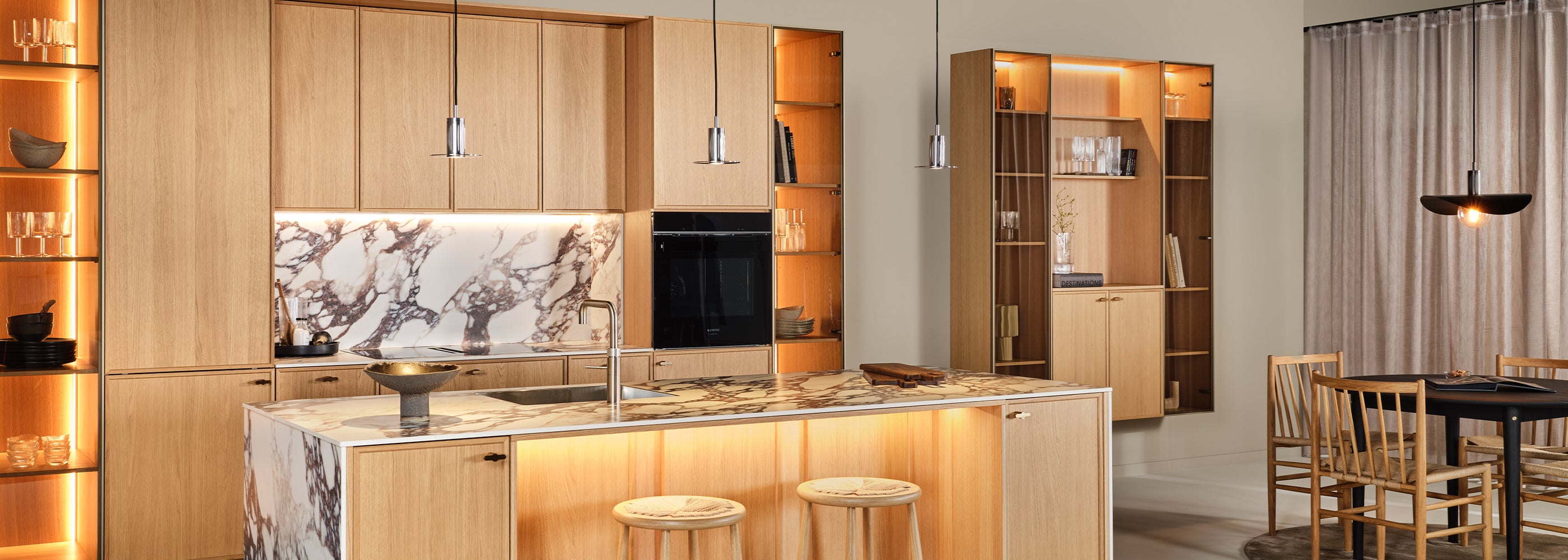 steel pendant lights above kitchen table